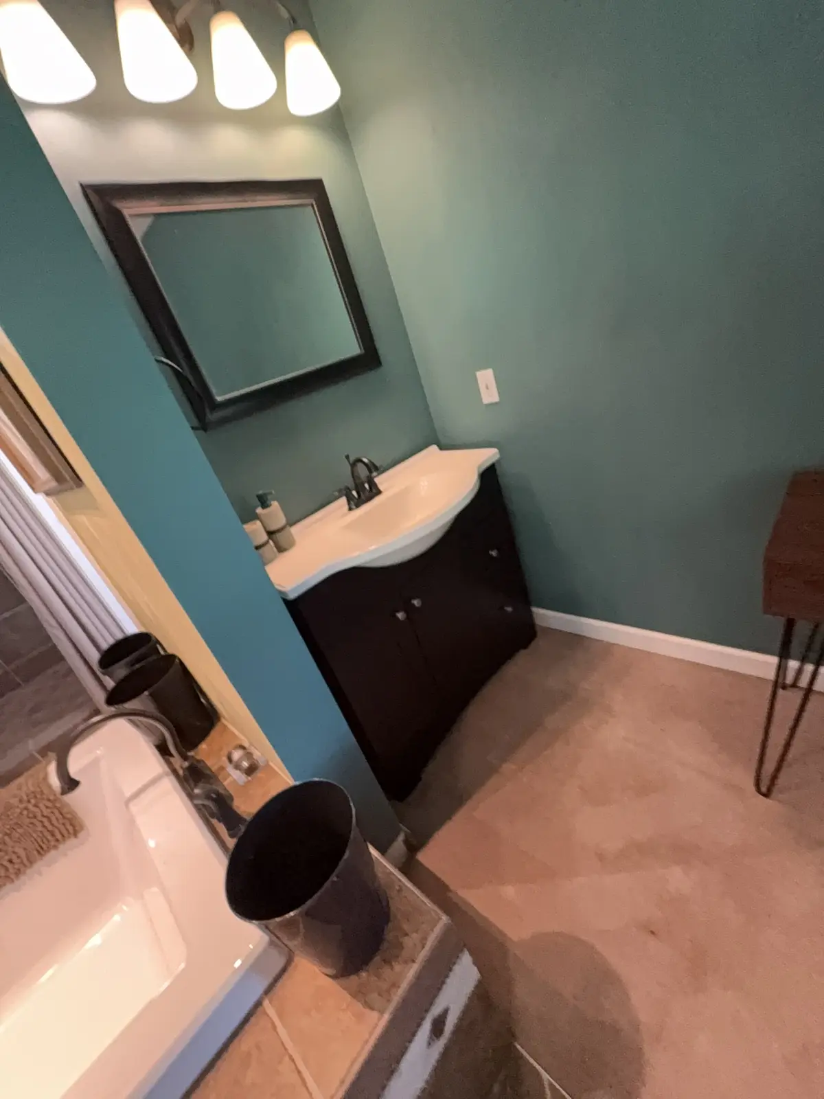 Clean bathroom vanity and mirror in a Hampton Roads client home