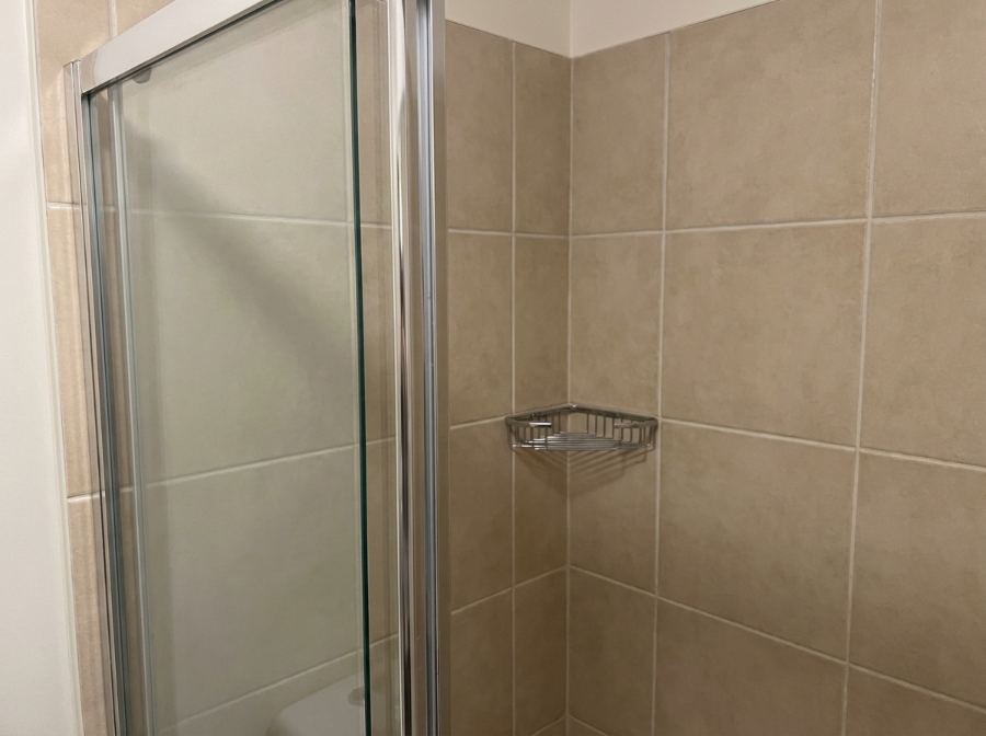 Clean glass shower door and tile in a coastal Virginia bathroom